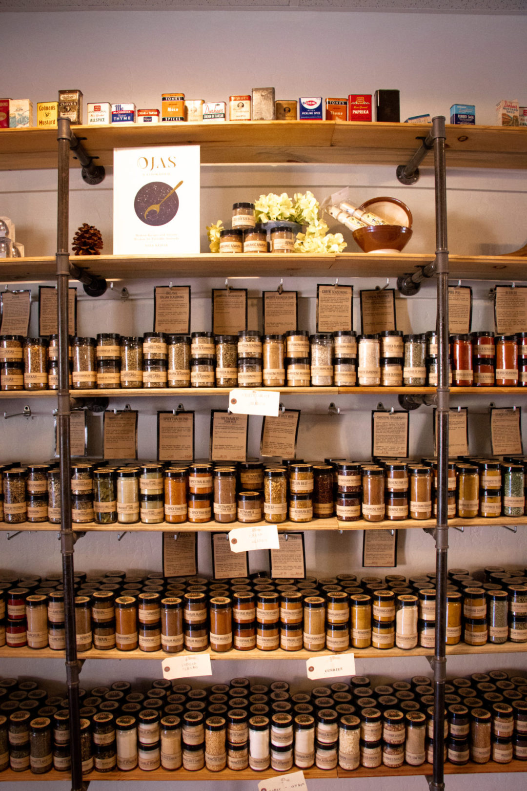 A shelf full of spice blends inside The Spice Merchant in Solvang, California