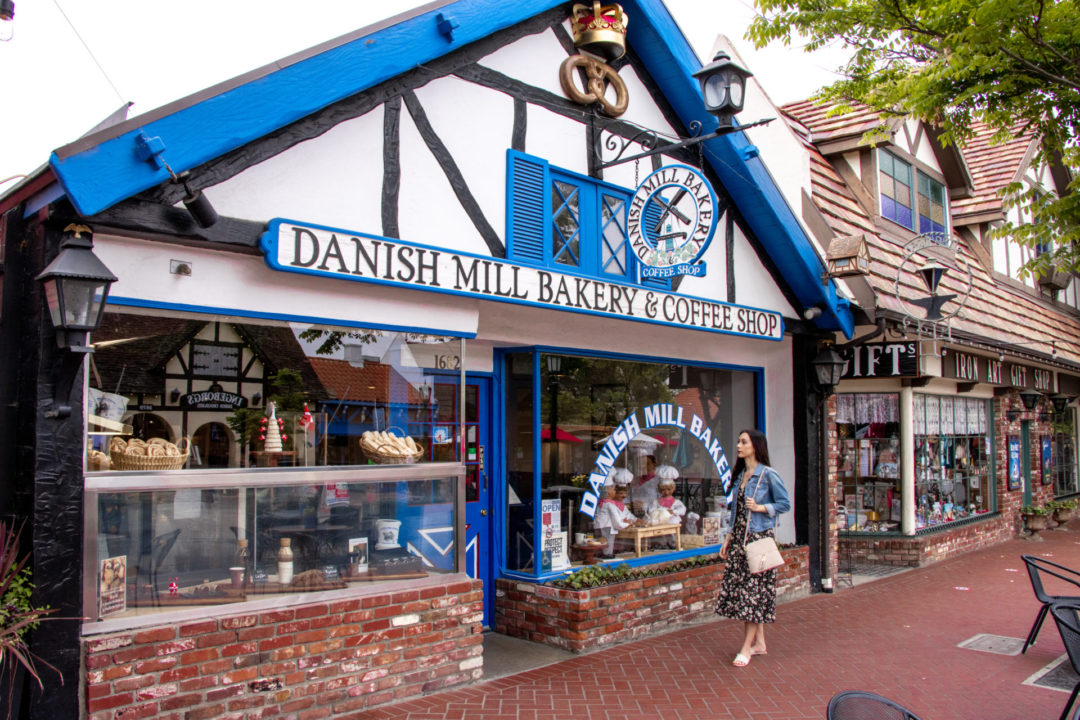 Solvang Travel Guide: Jordan Gassner window shopping at the Danish Mill Bakery & Coffee Shop in Solvang, California, USA