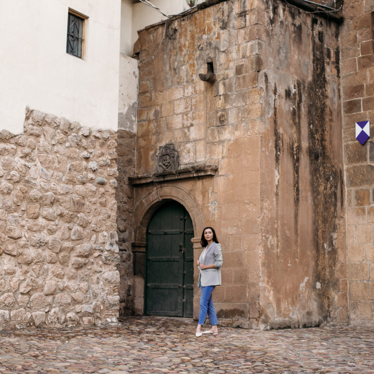 Jordan Gassner looking around the entrance of the Main Cathedral in Cusco's Plaza de Armas
