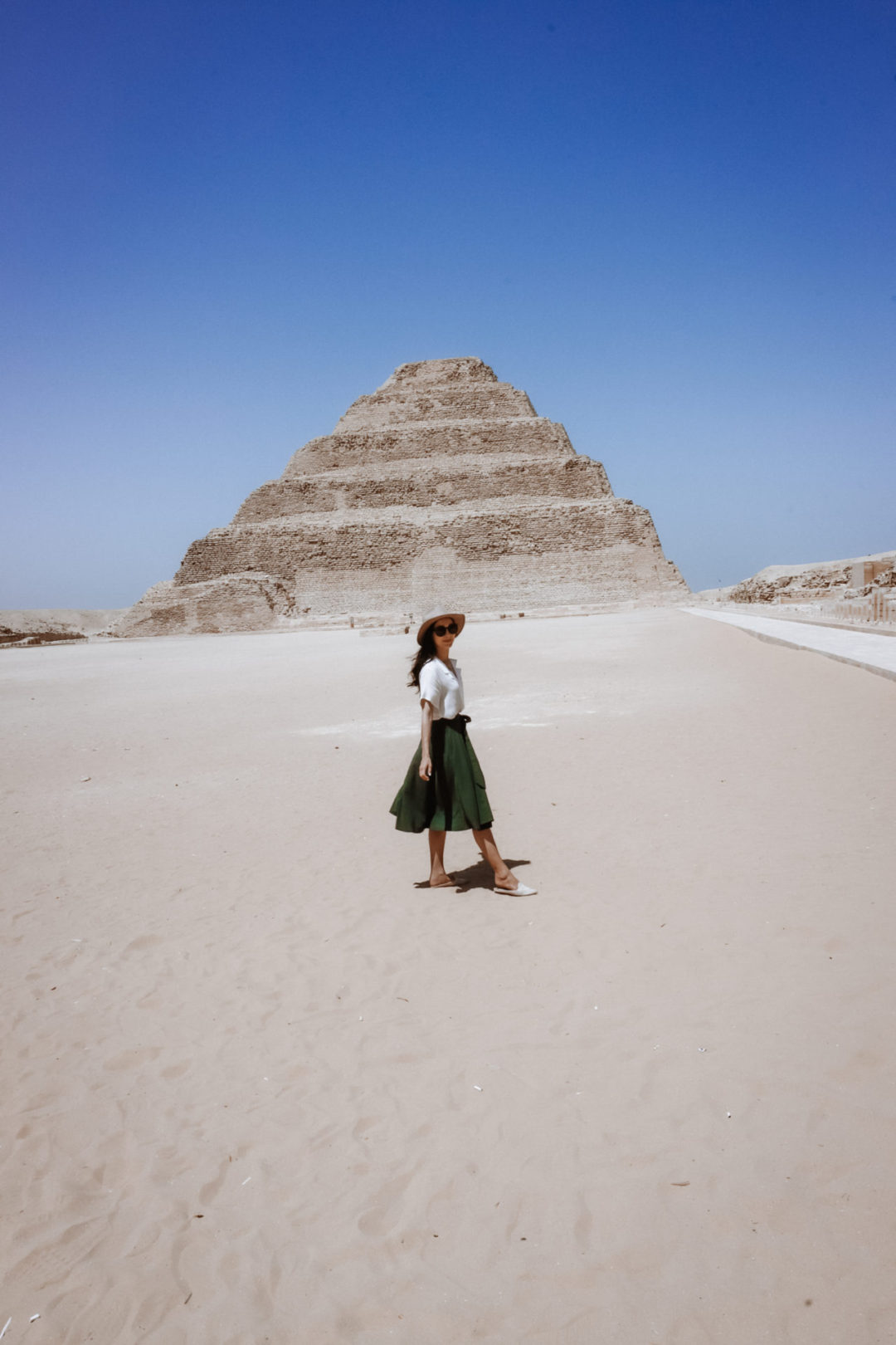 The Mummy Travel Guide: Travel Blogger Jordan Gassner standing in front of the Pyramid of Djoser in Egypt