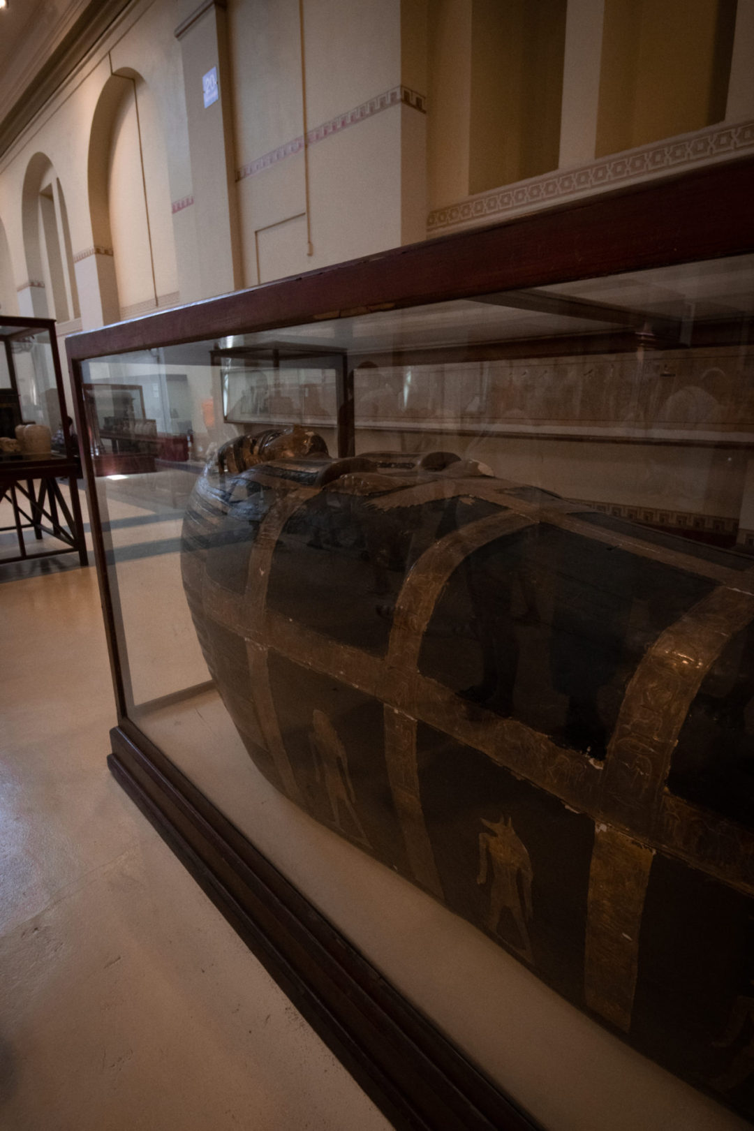 The Mummy Travel Guide: A black and gold ancient Egyptian sarcophagus inside Cairo's Egyptian Museum of Antiquities