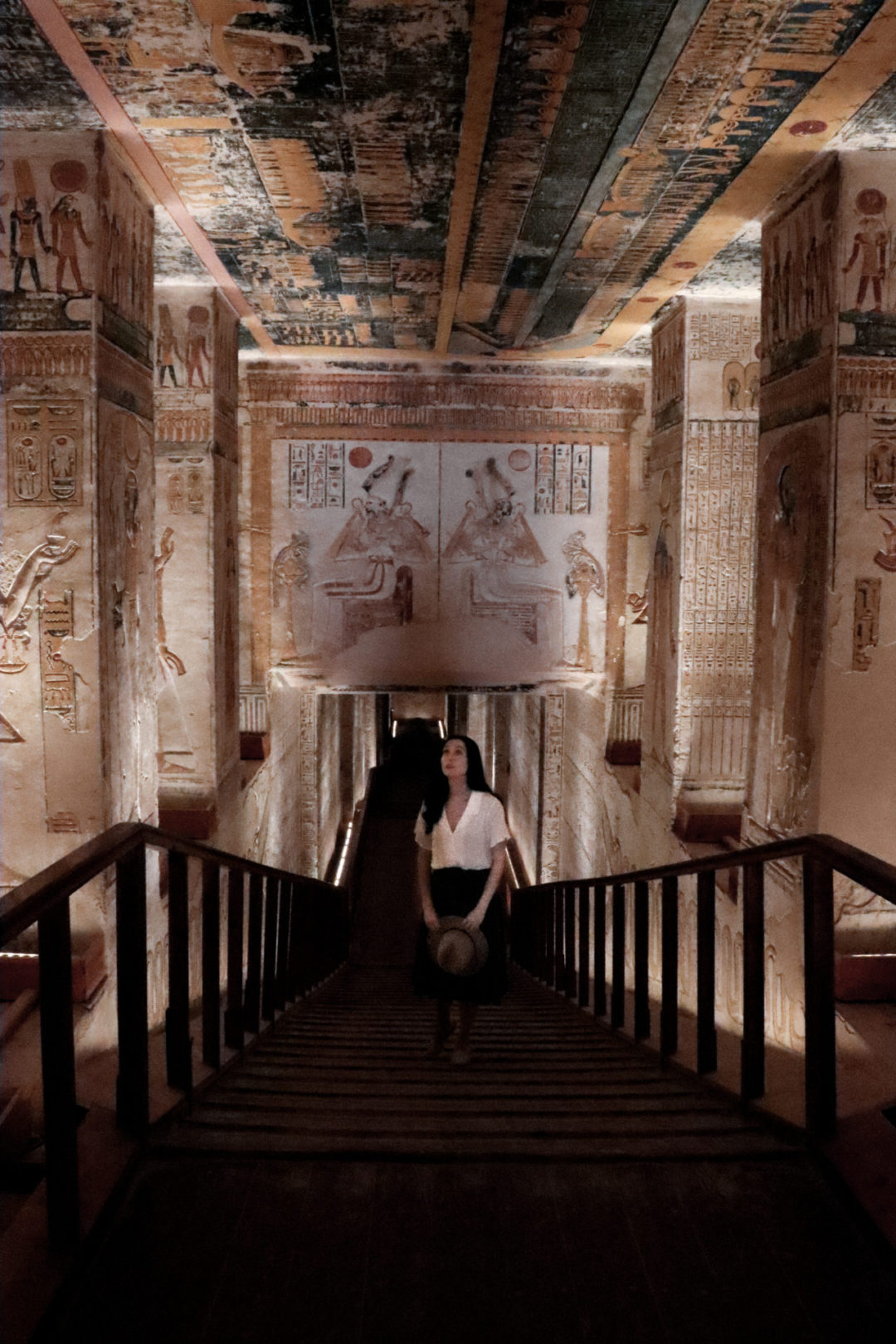 Travel Blogger Jordan Gassner looking up at the ceiling while inside a walkway of Egypt's KV9 Tomb in Valley of the Kings