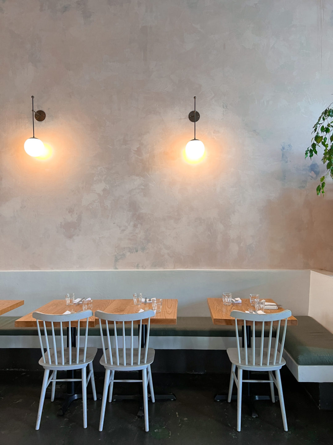 A modern light blue set of tables at Botanica Restaurant in LA's Silverlake Neighborhood