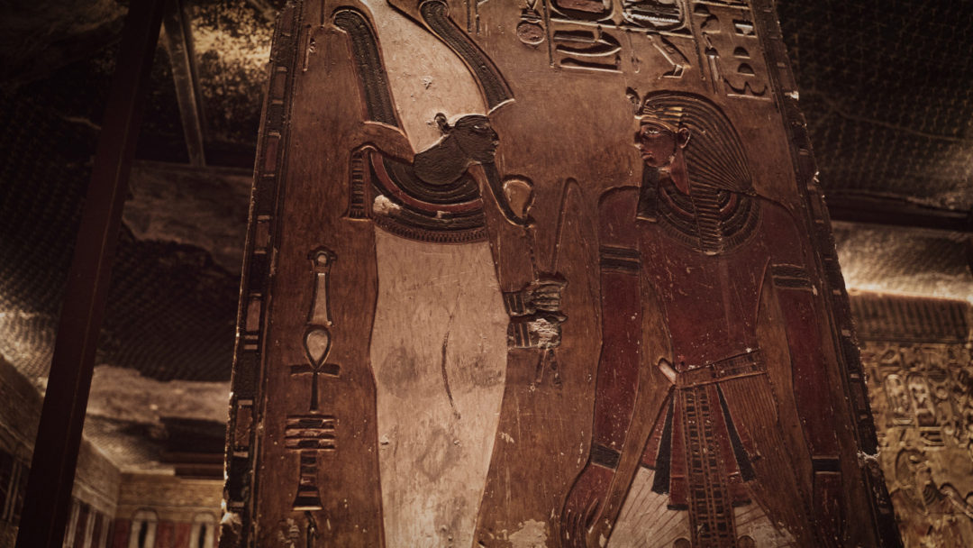A depiction of Osiris and another figure decorating the walls of the tomb inside Egypt's Valley of the Kings.