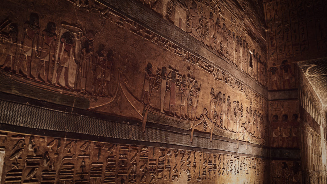 A wall of hieroglyphs inside a tomb inside the Valley of the Kings in Luxor, Egypt