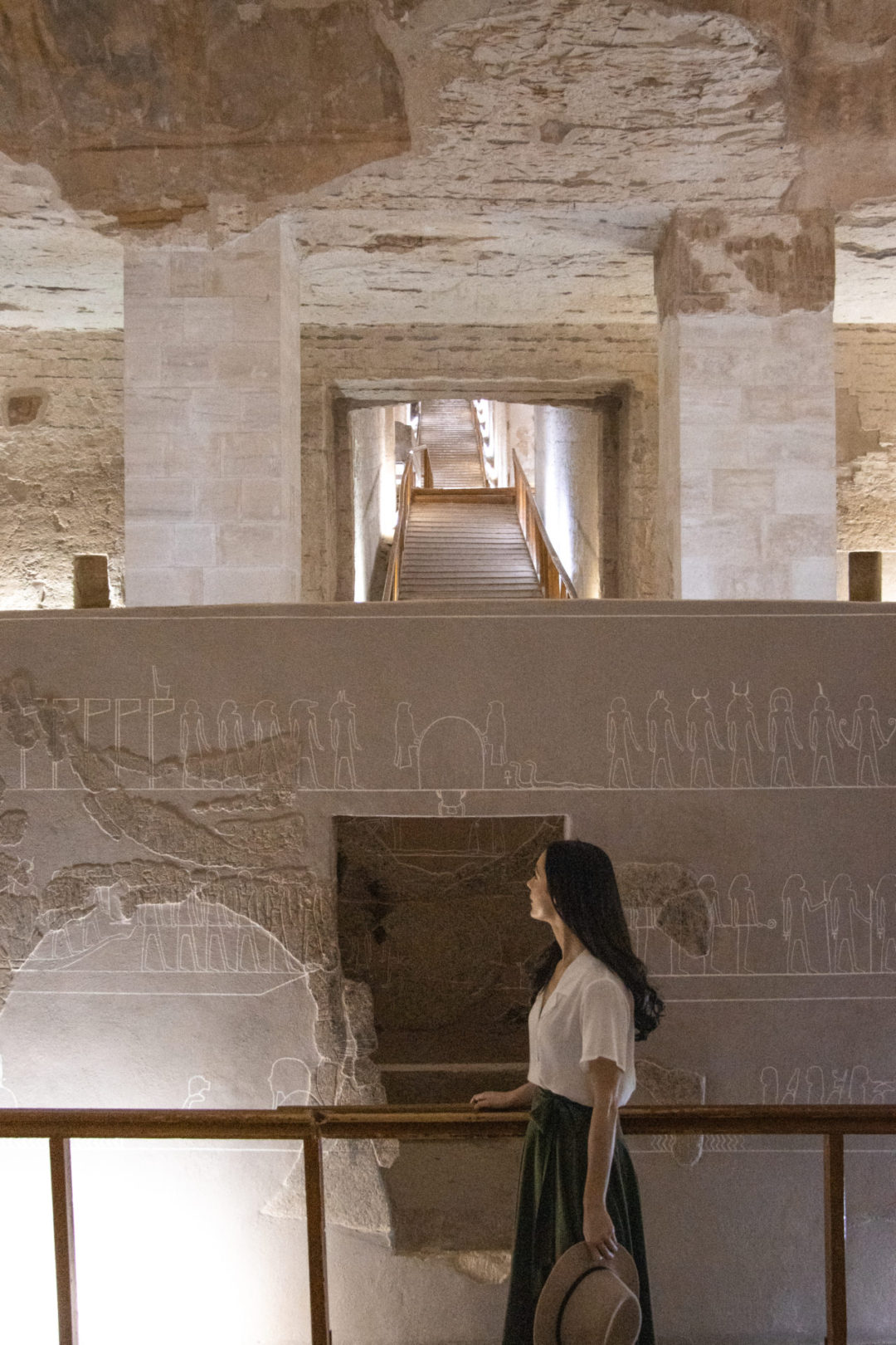 Travel Blogger Jordan Gassner standing next to the large sarcophagus inside the Tomb of Merenptah in Luxor, Egypt