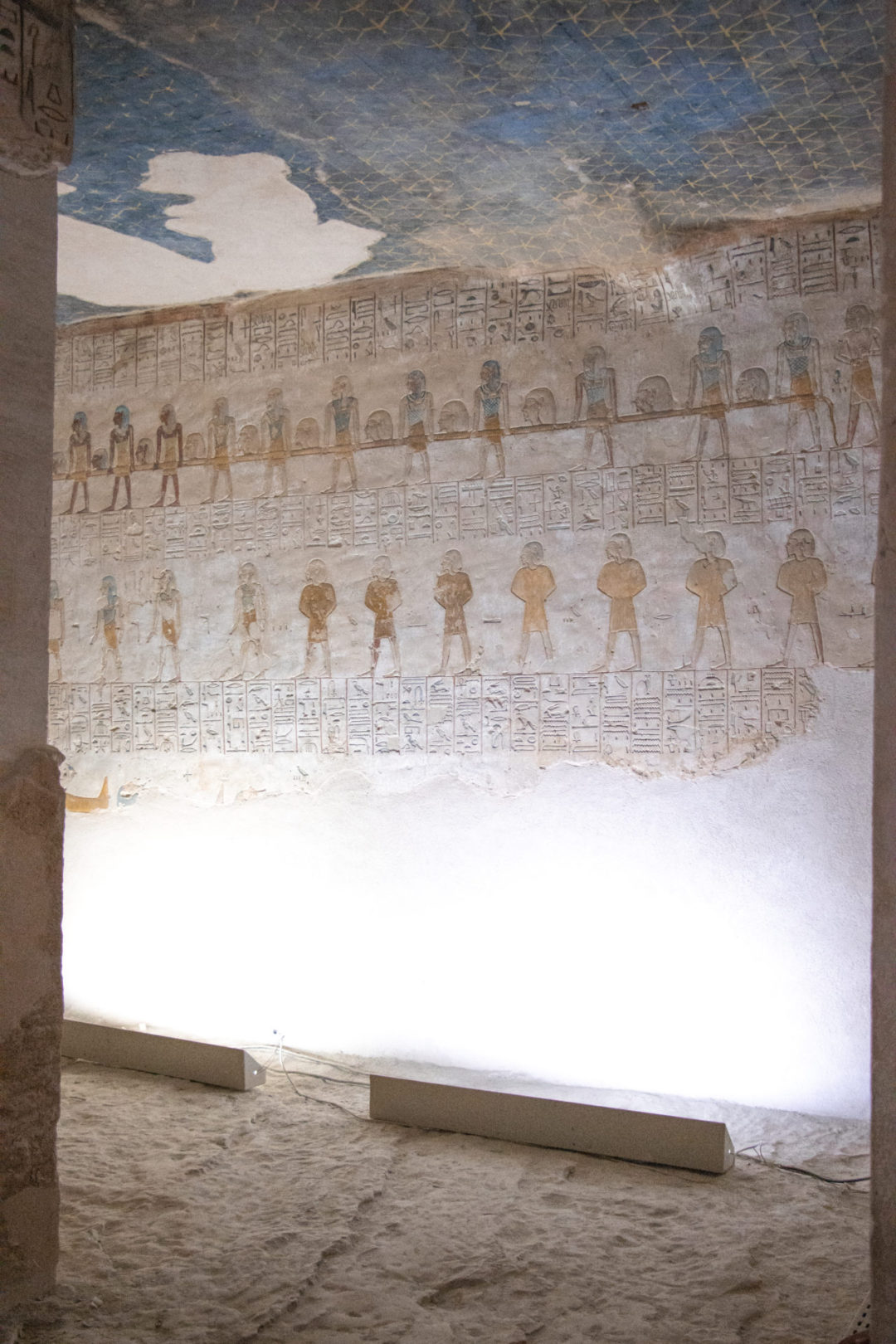 Vibrant hieroglyphs under a dark blue ceiling inside the Tomb of Merenptah in Valley of the Kings in Luxor, Egypt