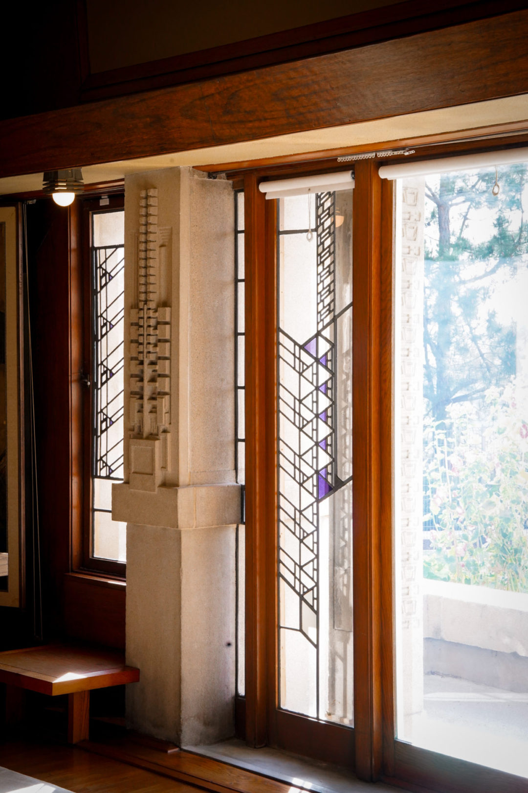 The hollyhock flower motif reflected in Hollyhock House's walls and stained glass