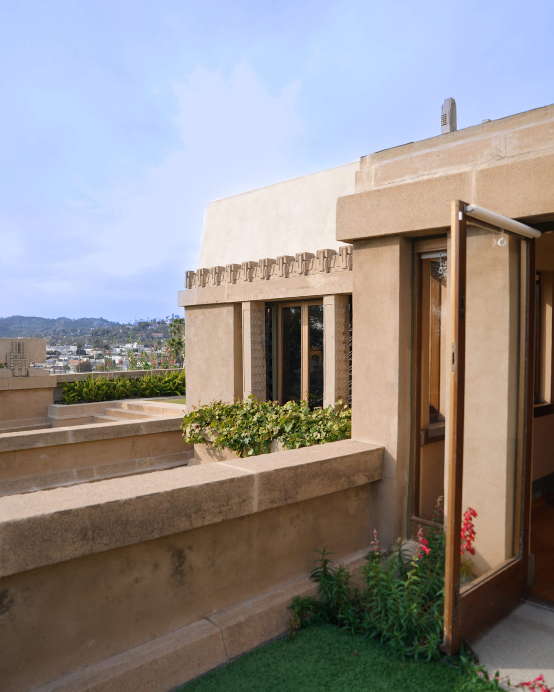 An open doorway leading from the backyard into one of the rooms inside the UNESCO World Heritage site, Hollyhock House