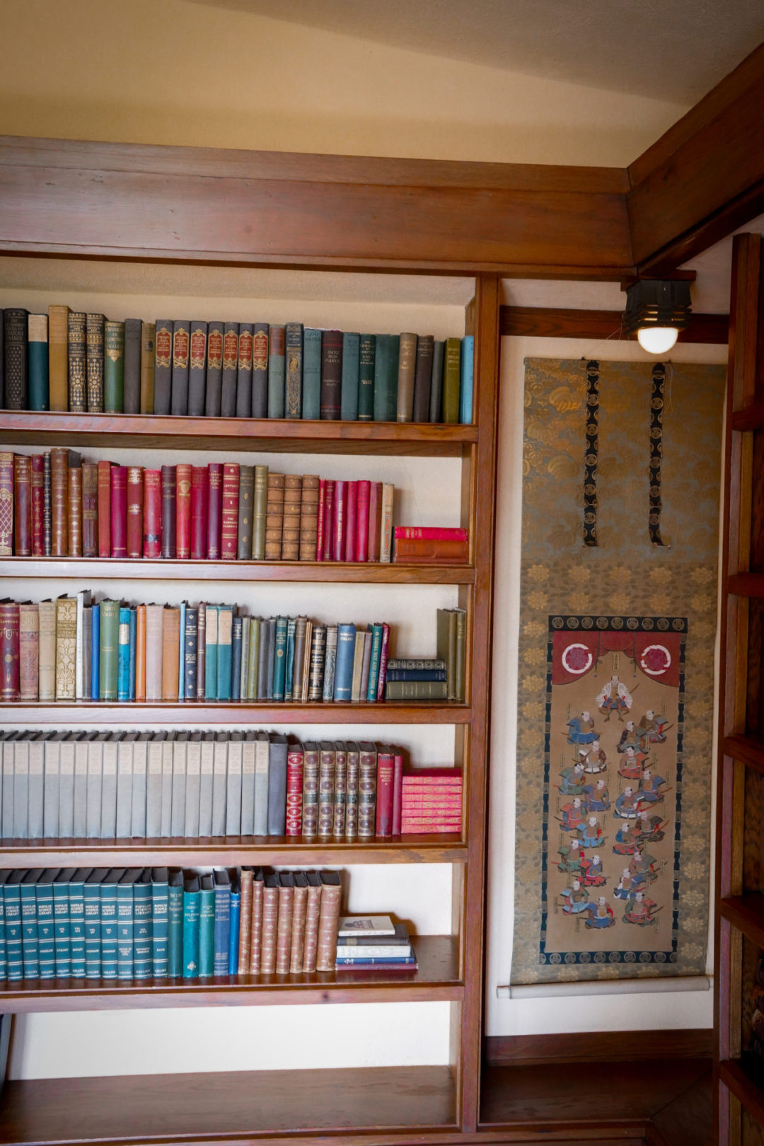 A bookcase and matching tapestry inside Hollyhock House in Los Angeles, California
