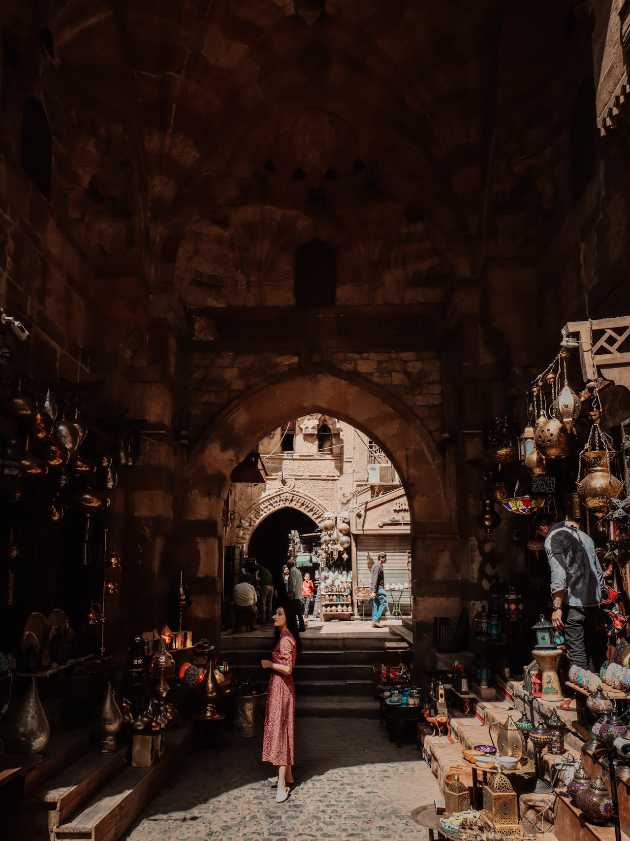 Travel Blogger Jordan Gassner admiring a shop filled with lanterns inside Khan El-Khalili Bazaar in Cairo, Egypt