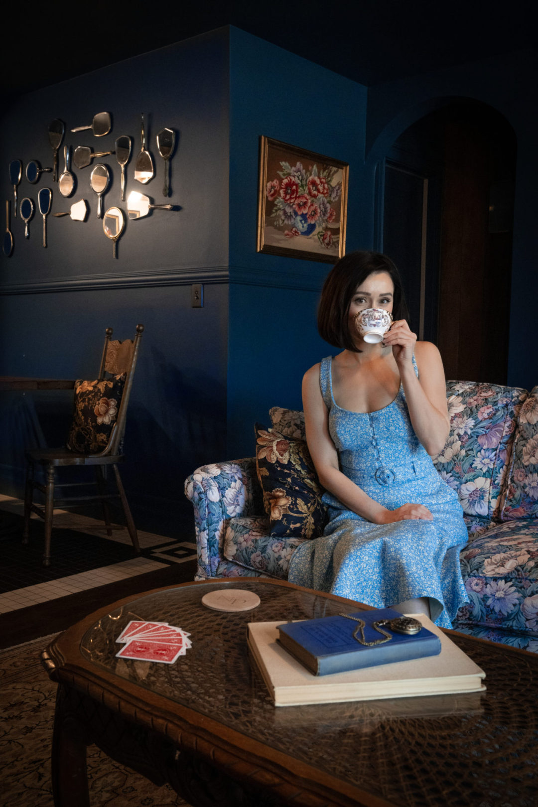Travel Blogger Jordan Gassner sipping a cup of tea in the living room of Lucille's Manor at the Noble + Proper Hotel in Big Bear, California