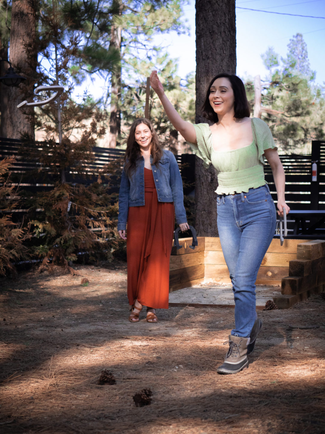 Travel Blogger Jordan Gassner and her friend Sarah playing horseshoes in the common areas of the Noble + Proper Hotel
