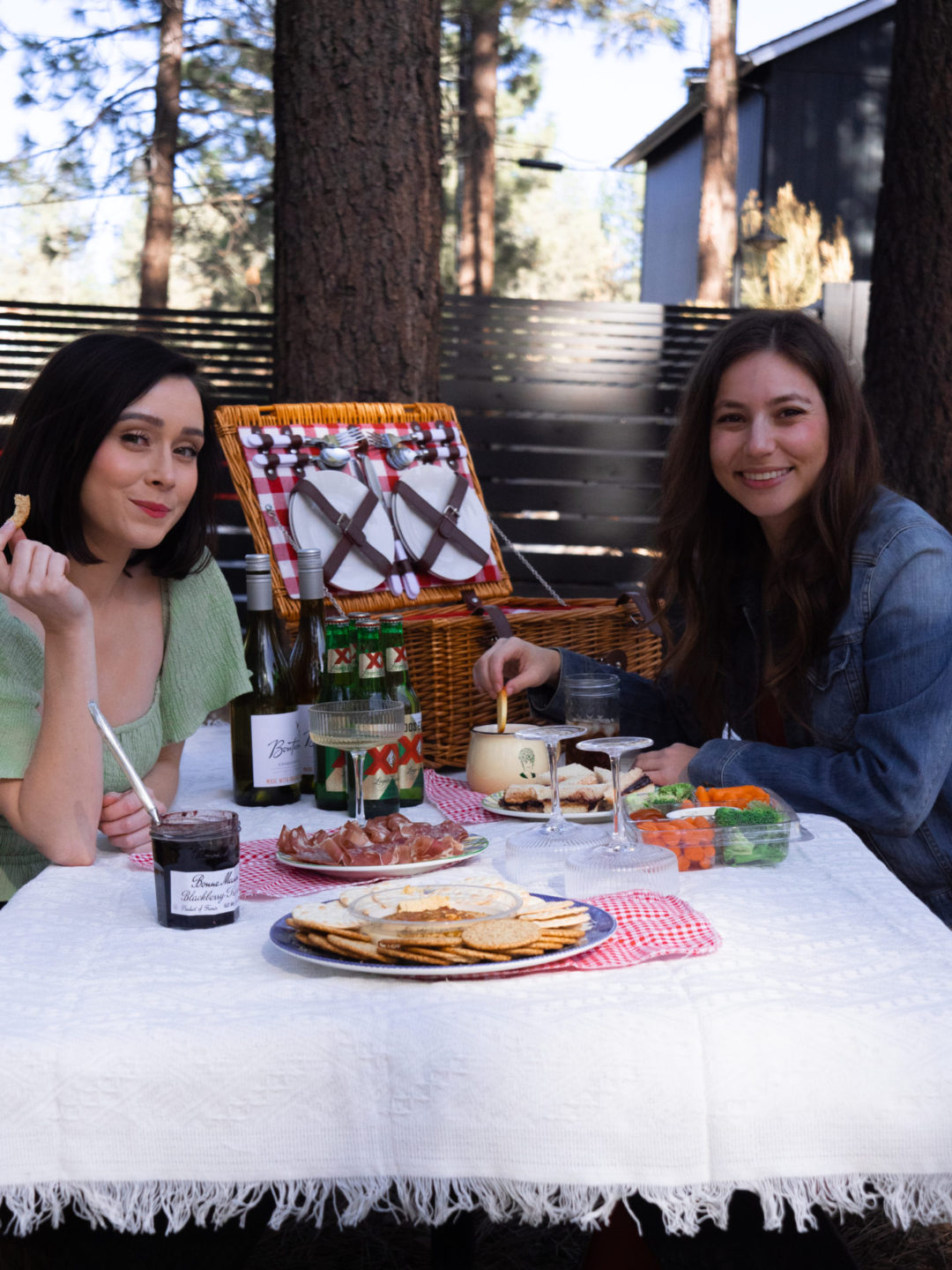 Travel Blogger Jordan Gassner and her friend Sarah enjoying a picnic at the Noble + Proper Hotel in Big Bear, California