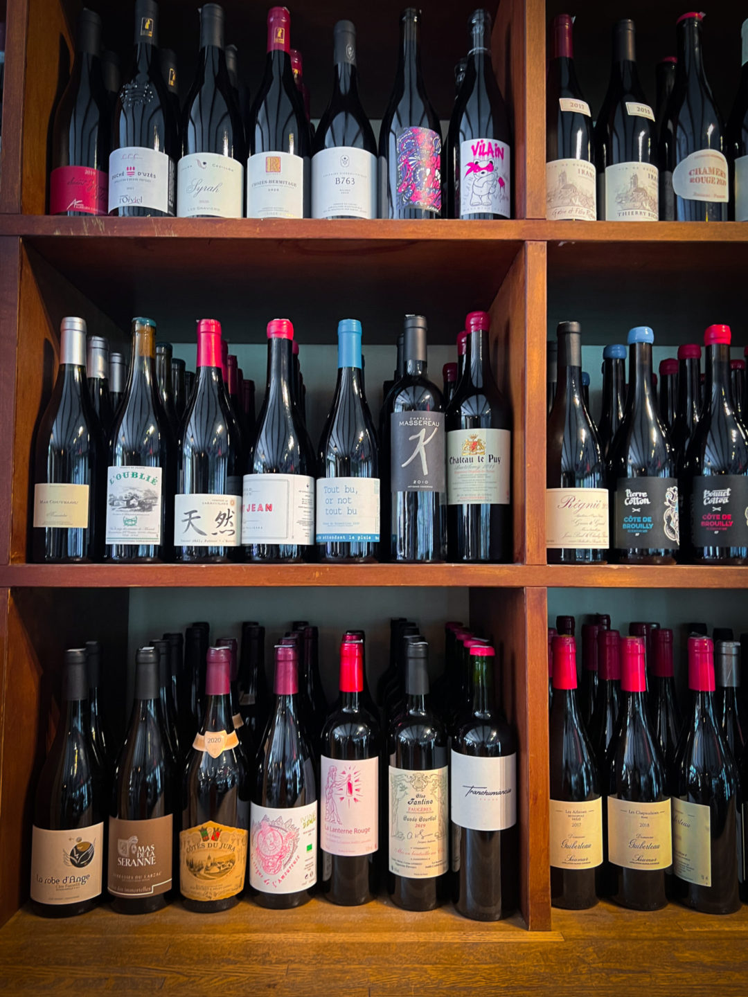 a shelf full of natural red wines inside Vin On Rose in Venice, Beach California