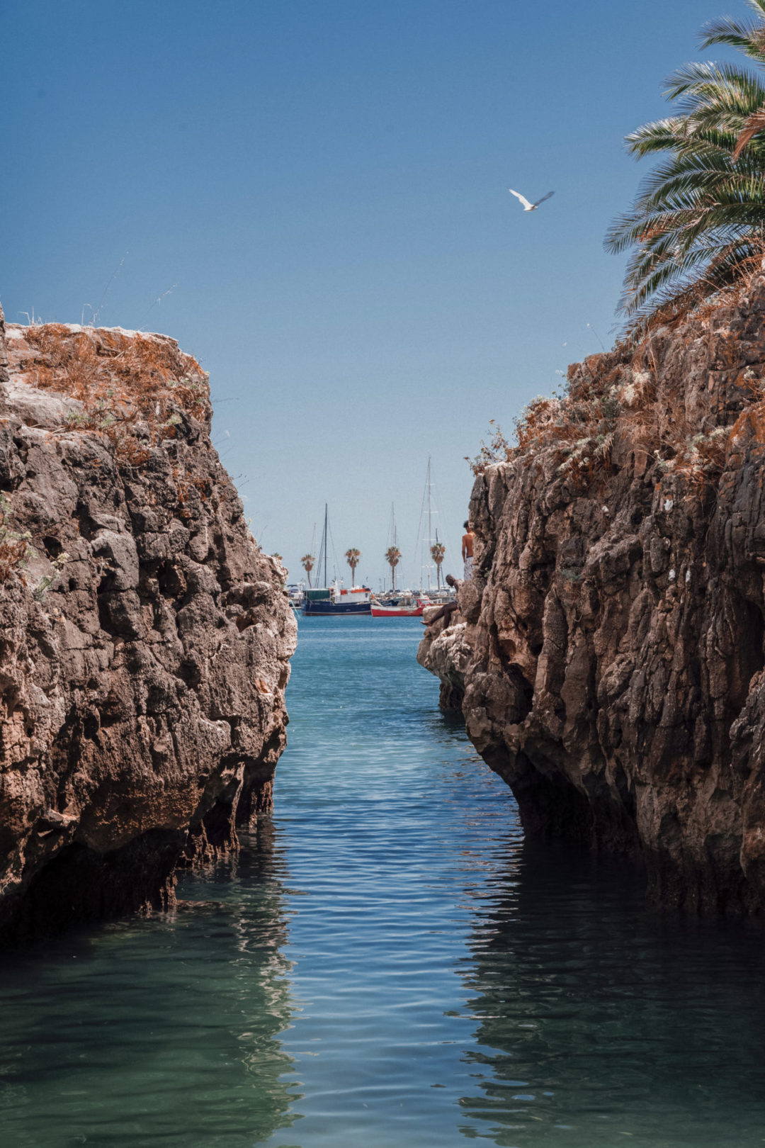 A break in the cliffs near the beach at Cascais, Portugal