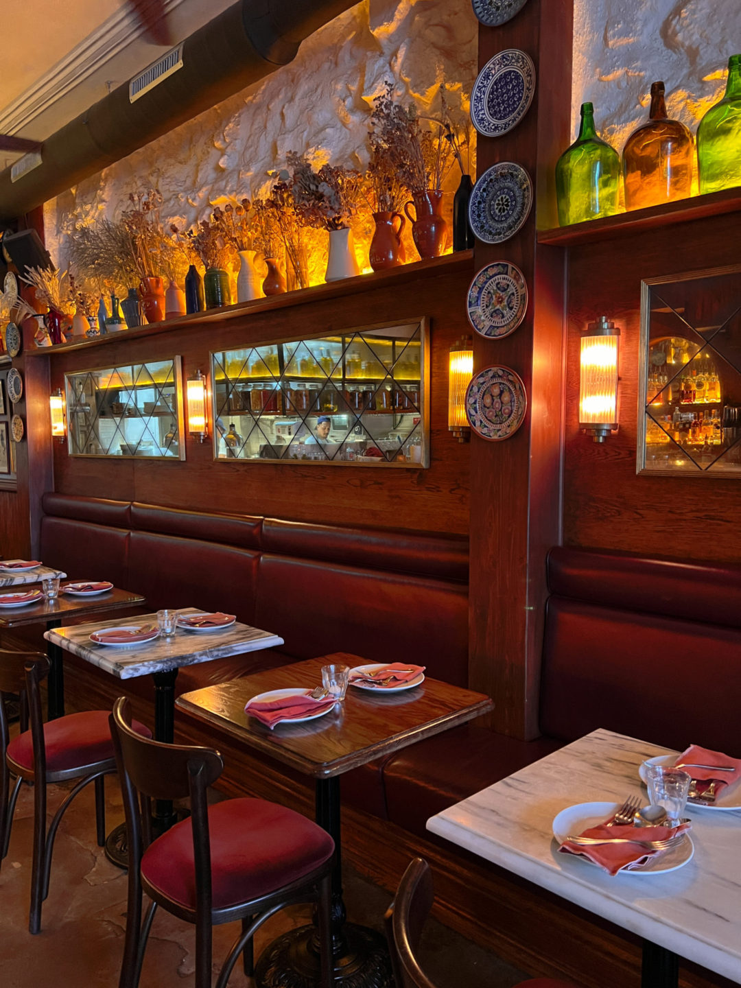 The red and wood dining room inside Leonetta in Lisbon, Portugal