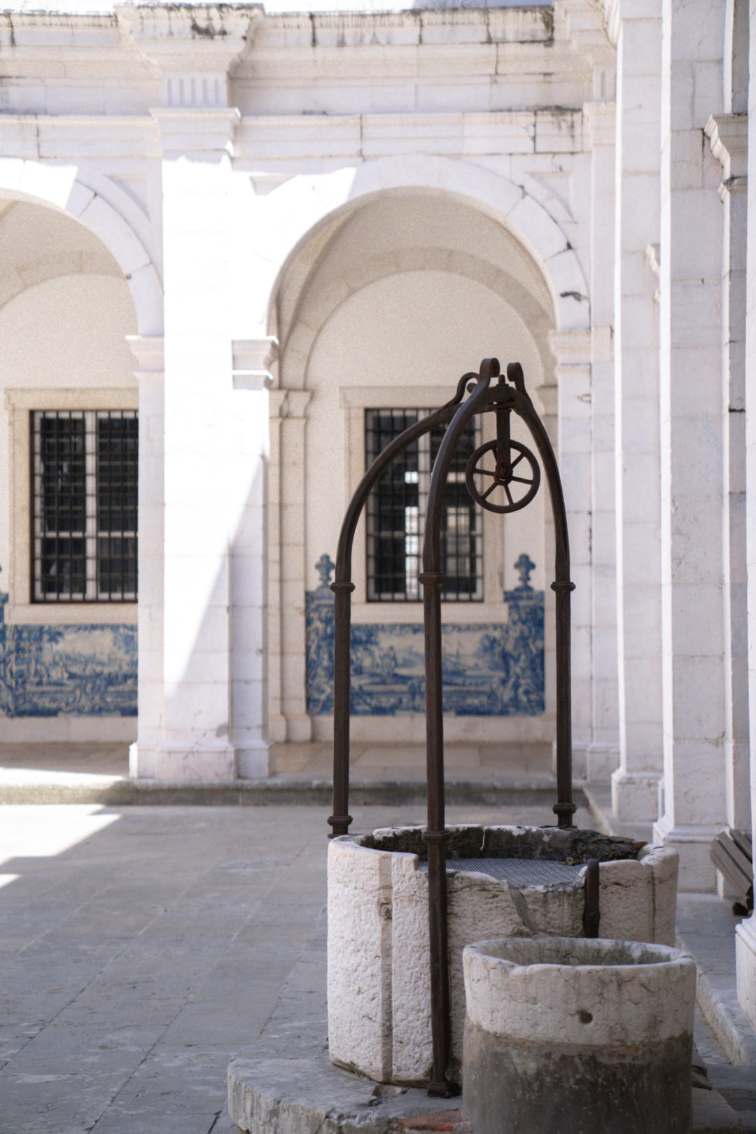 A well in a courtyard inside Mosteiro São Vicente De Fora, one of Jordan Gassner's favorite spots to take photos in Lisbon