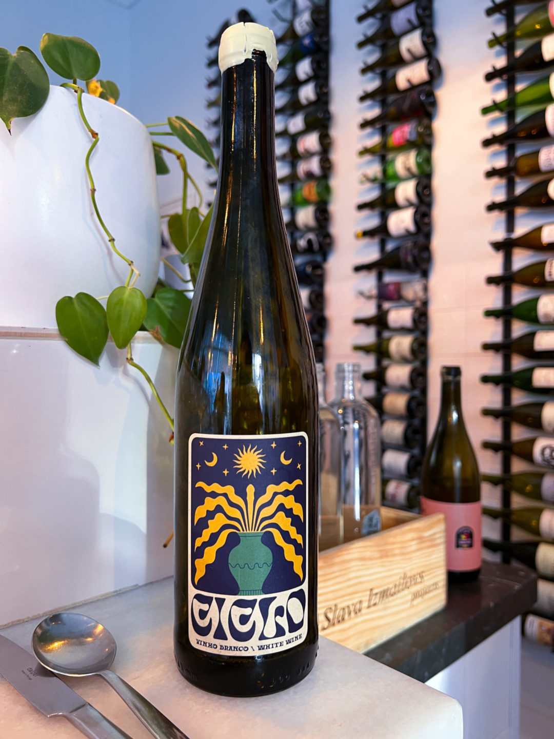 A bottle of Ciclo Wine Ceviche sitting on the bar at Senhor Uva in Lisbon, Portugal