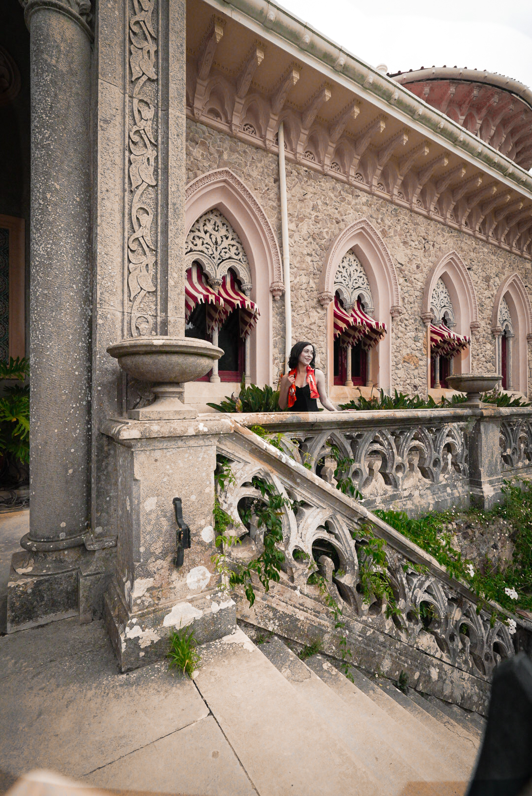 Travel Blogger Jordan Gassner standing along the back balcony of Monserrate Palace in Sintra, Portugal