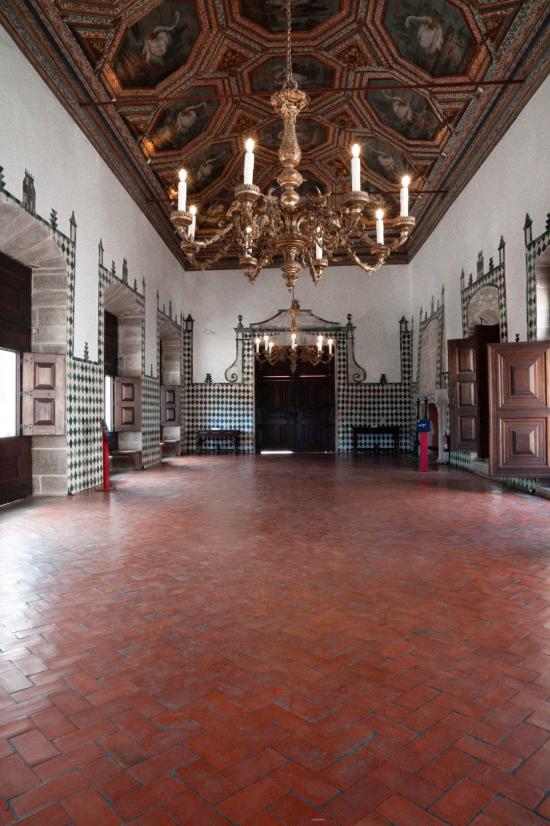 An empty great hall inside the Sintra National Palace in Portugal
