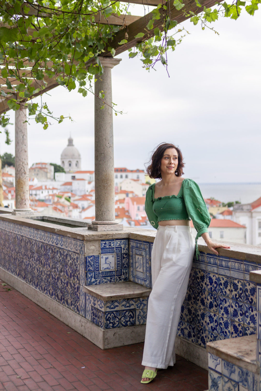 Travel Blogger Jordan Gassner looking out from Miradouro de Santa Luzia in Lisbon, Portugal