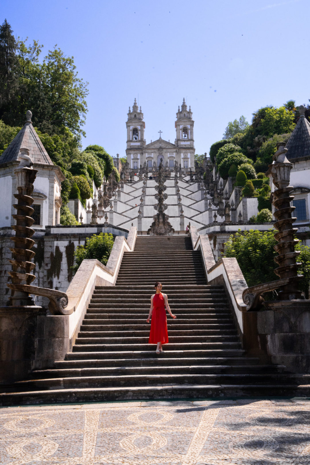 Travel Blogger Jordan Gassner walking down the Stairway of the Five Senses at Bom Jesus Do Monte in Braga, Portugal