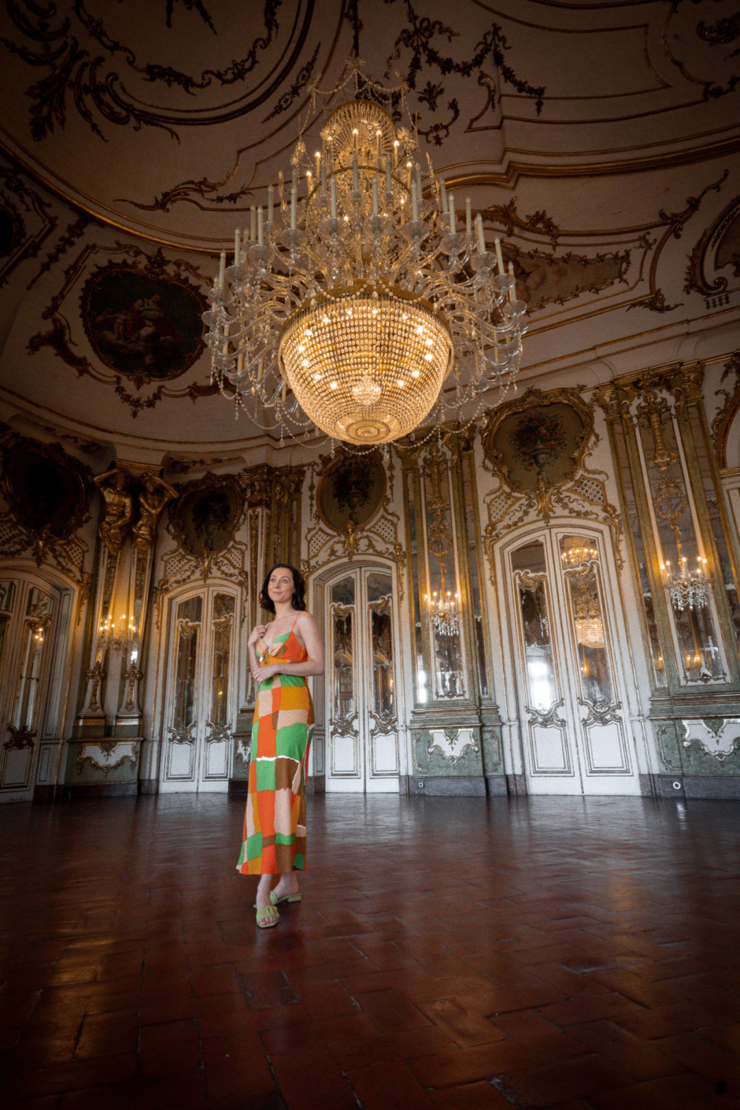 Travel Blogger Jordan Gassner inside the ballroom of Queluz National Palace in Lisbon, Portugal