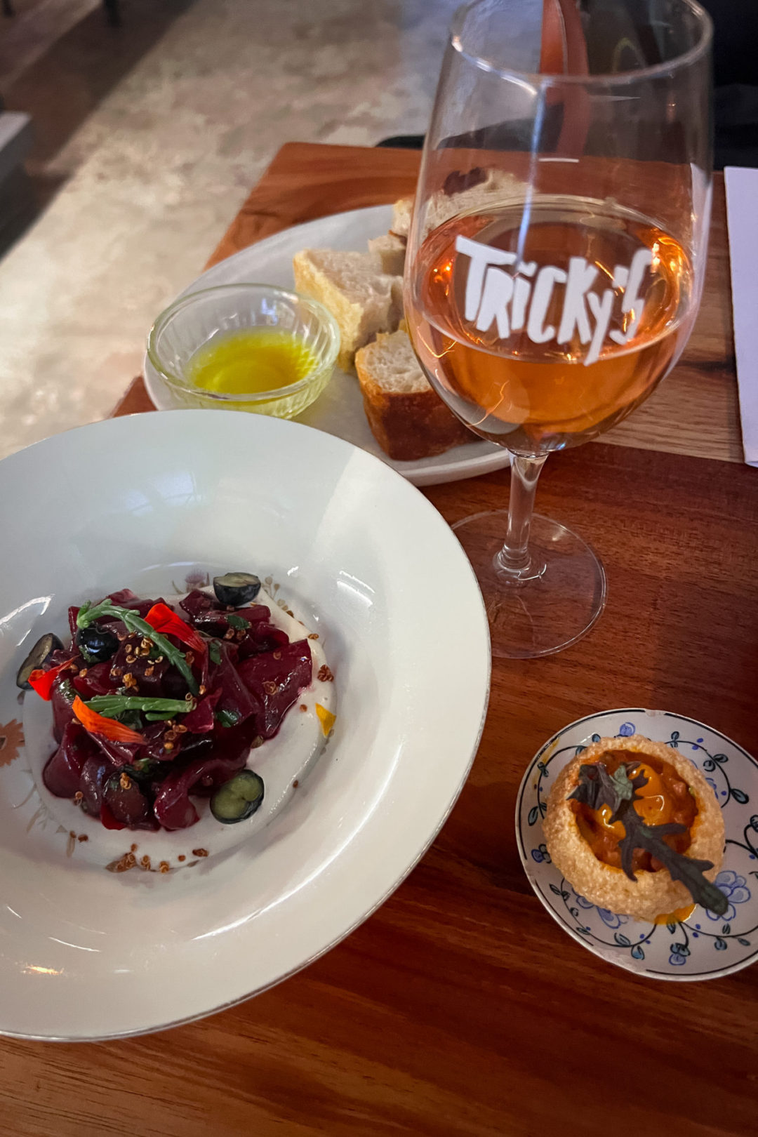 A few colorful appetizers and a glass of natural wine from Tricky's in Lisbon, Portugal