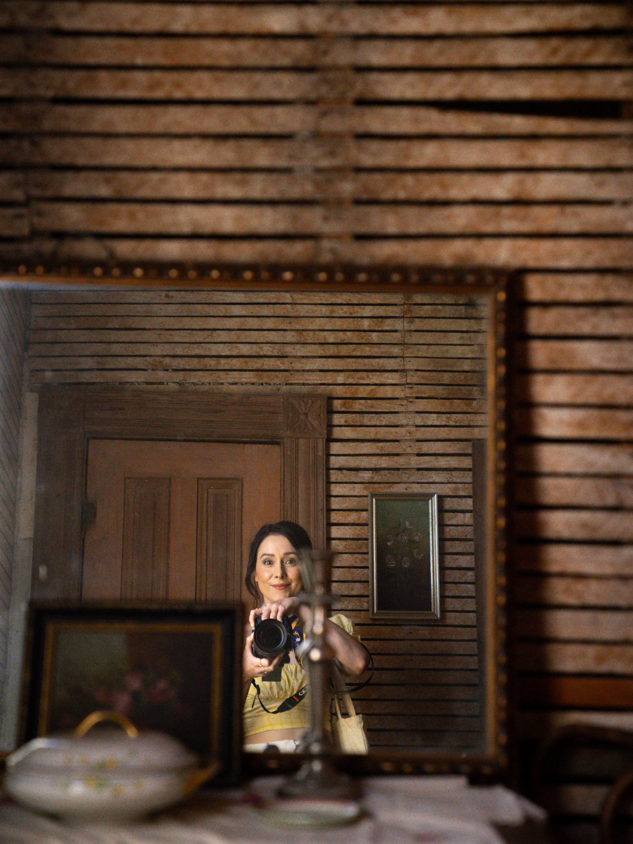 Home Tours in Los Angeles: Travel Blogger Jordan Gassner taking a mirror selfie with a DSLR on location at LA's Heritage Square Museum