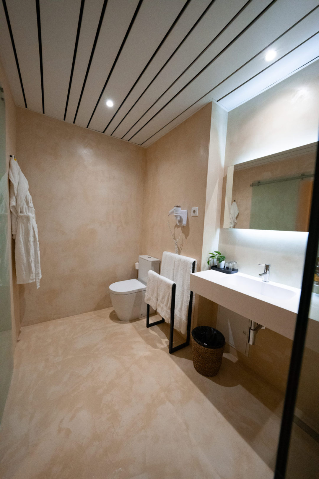 A spacious beige and white bathroom with lots of counter space inside a room at Lamego Hotel & Life