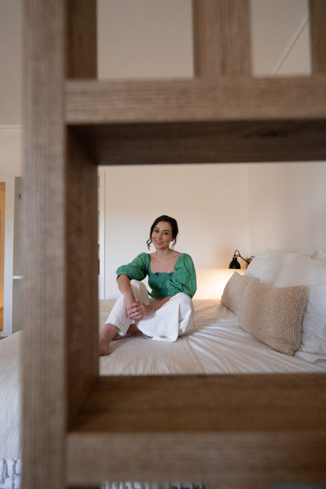 Travel Blogger Jordan Gassner smiling inside a room at Lamego Hotel & Life in Portugal's Douro Valley