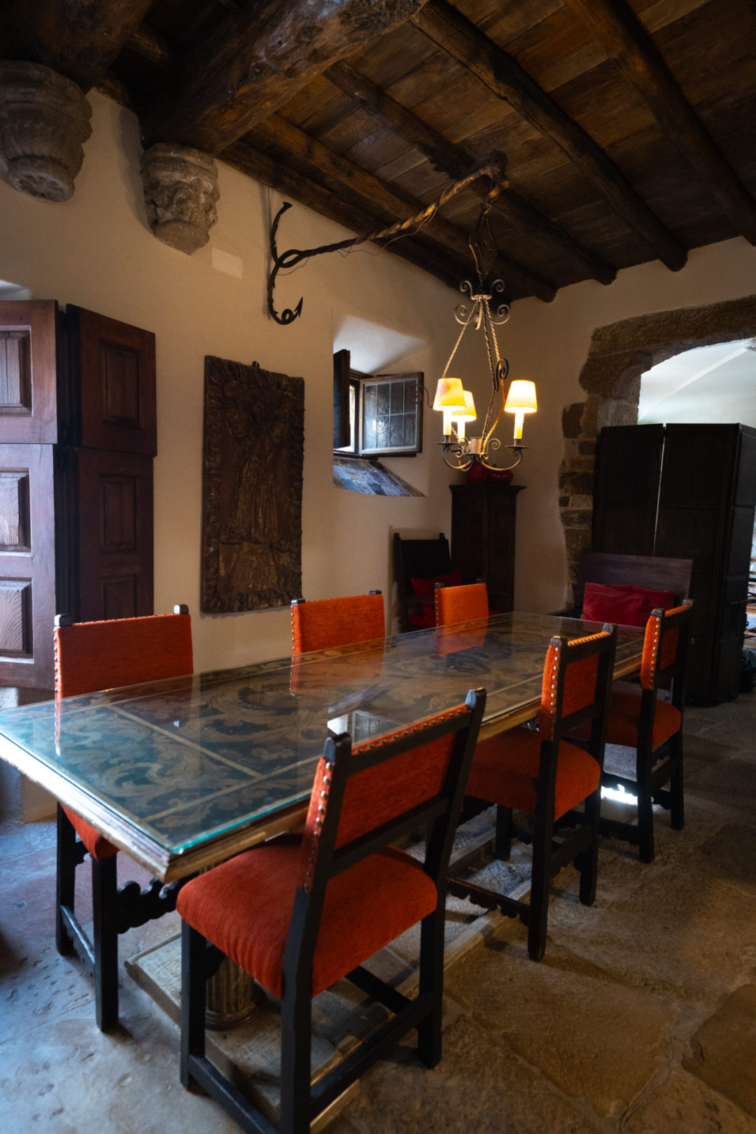 A dining room table inside the main building of Torre De Maneys in Obidos, Portugal