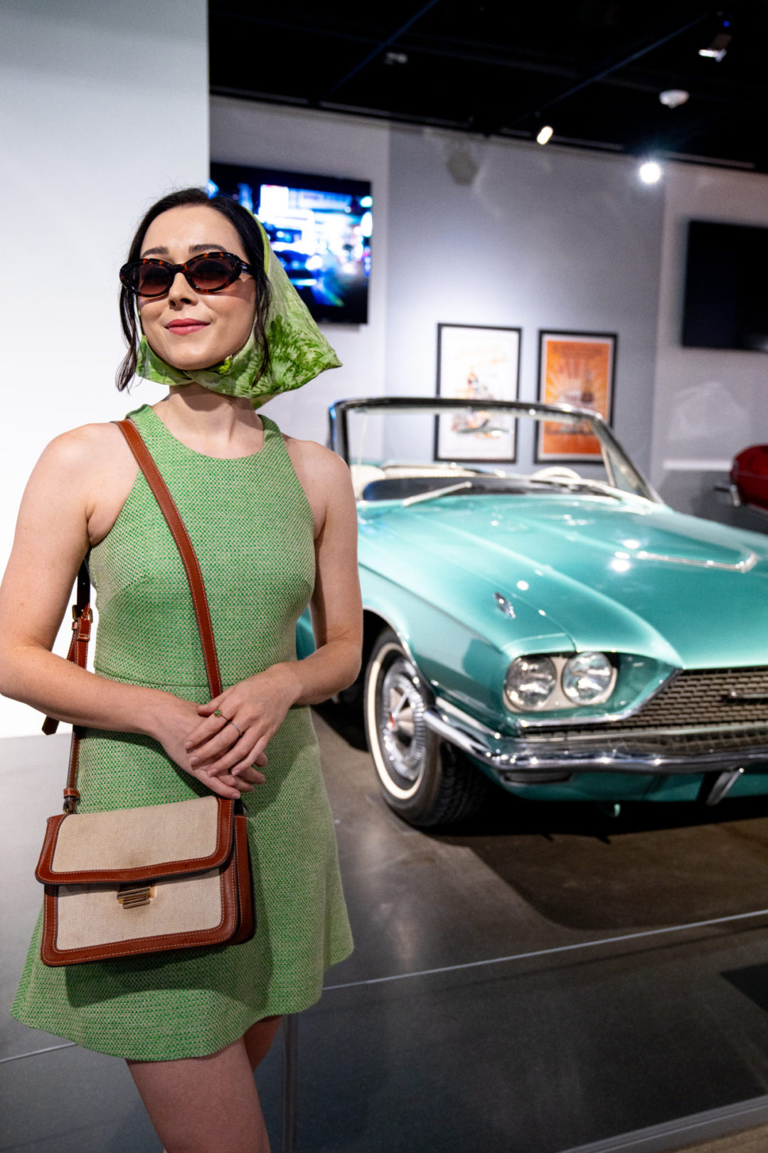 Travel Blogger Jordan Gassner standing in front of Thelma and Louise's car at the Petersen Automotive Museum in Los Angeles, California