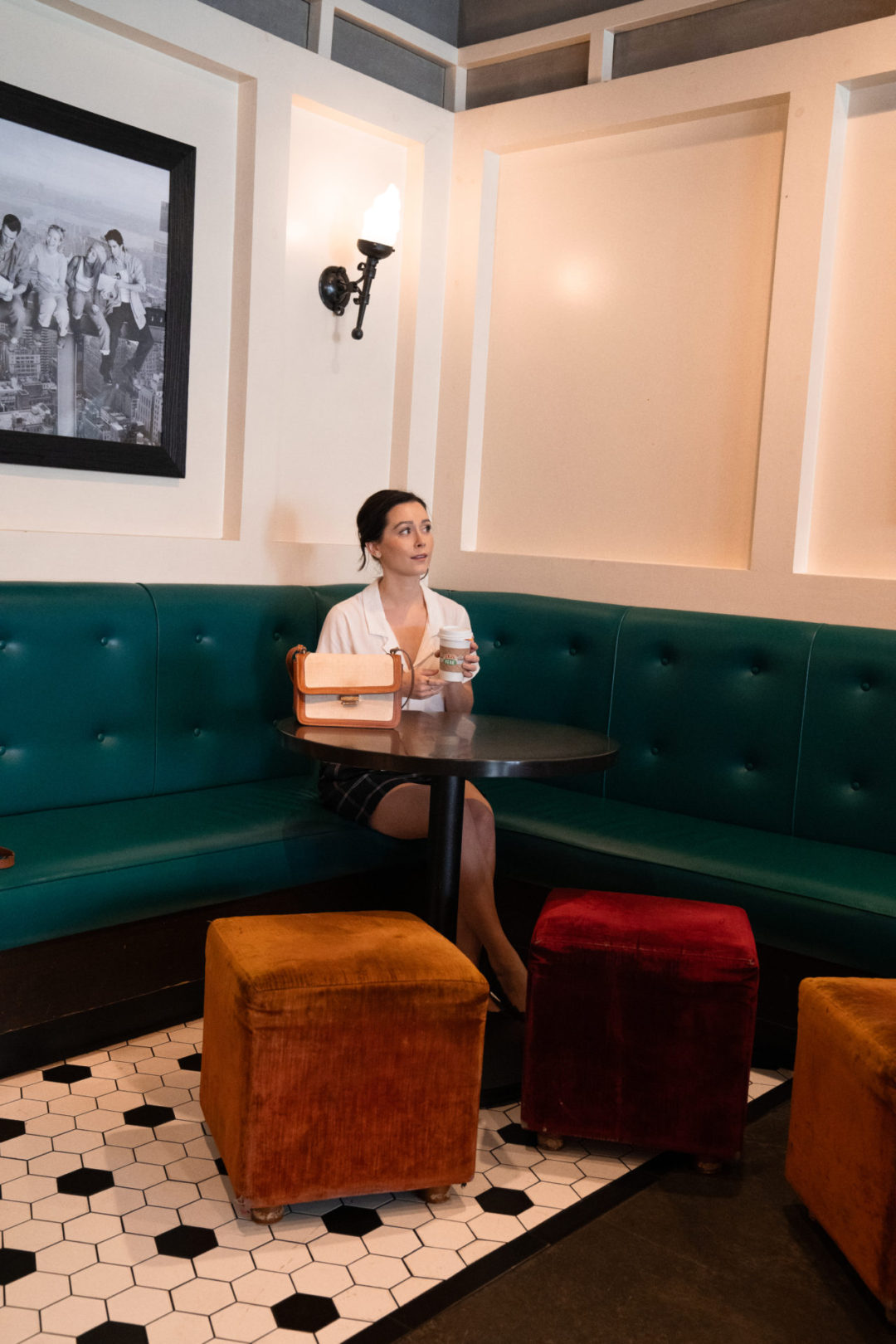 Travel Blogger Jordan Gassner enjoying the Friends-themed artwork at the Central Perk Cafe on the Warner Bros. Studio Lot in Burbank, California, USA