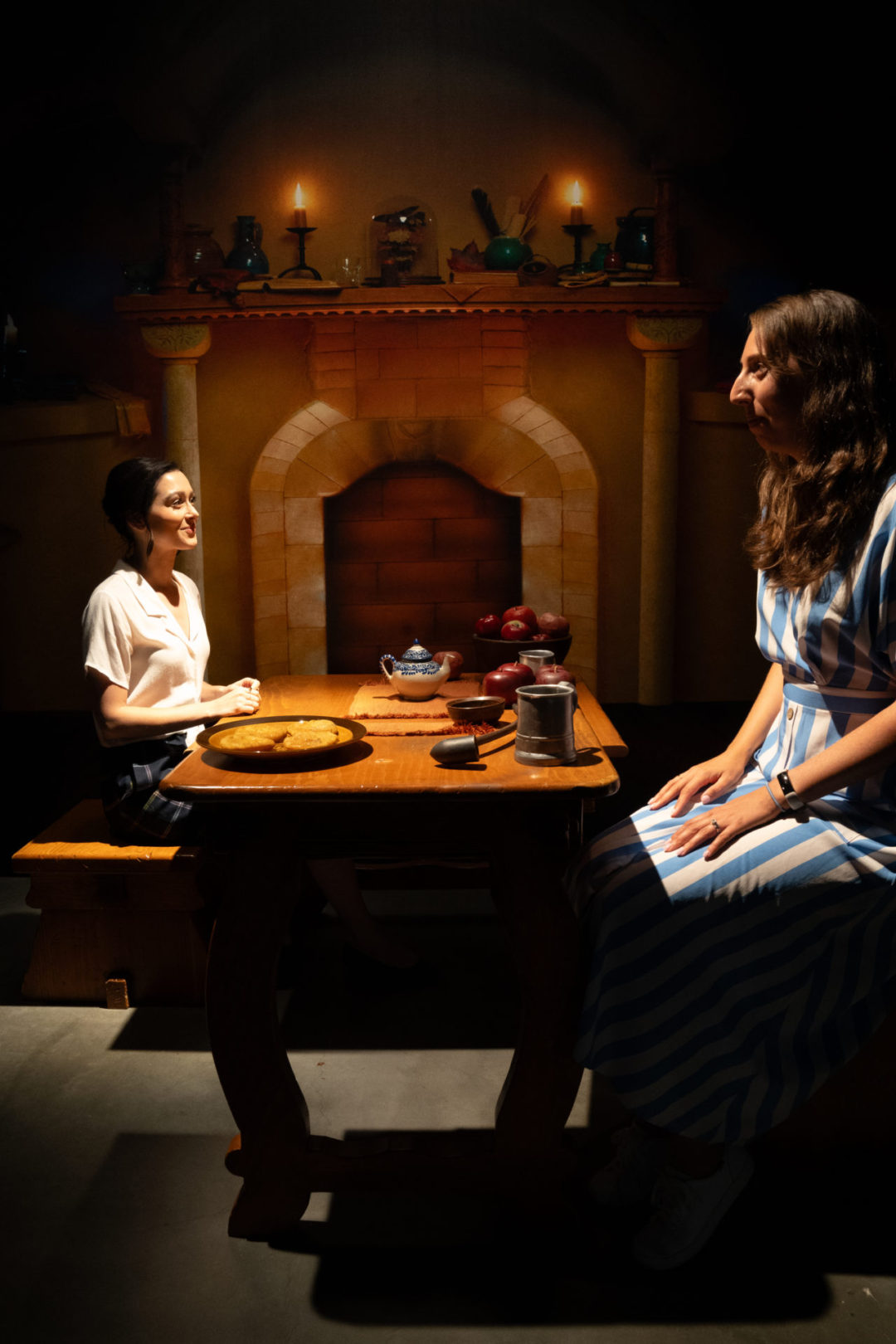 Travel Blogger Jordan Gassner and her friend, Kate, experimenting with proportions on a Hobbit themed set inside the Warner Bros. Studio Tour