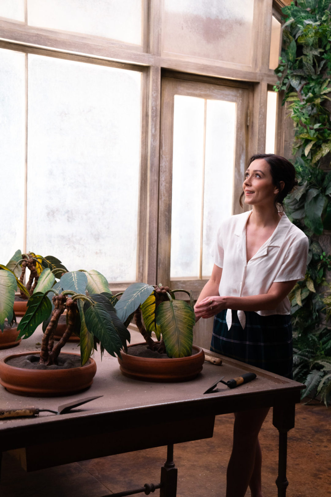 Travel Blogger Jordan Gassner "potting a plant" inside an interactive Harry Potter set while on the Warner Bros. Studio Tour in Burbank, California, USA