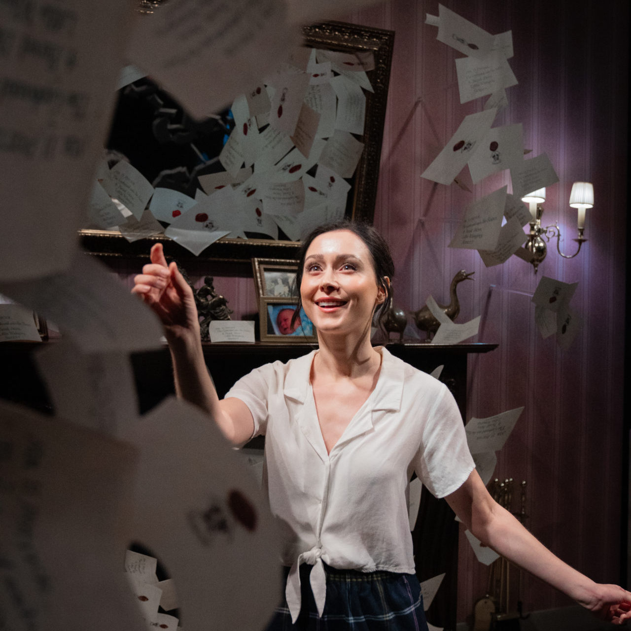 Travel Blogger Jordan Gassner reaching for a "flying" Hogwarts acceptance letter while on the Warner Bros. Studio Tour in Burbank, California, USA