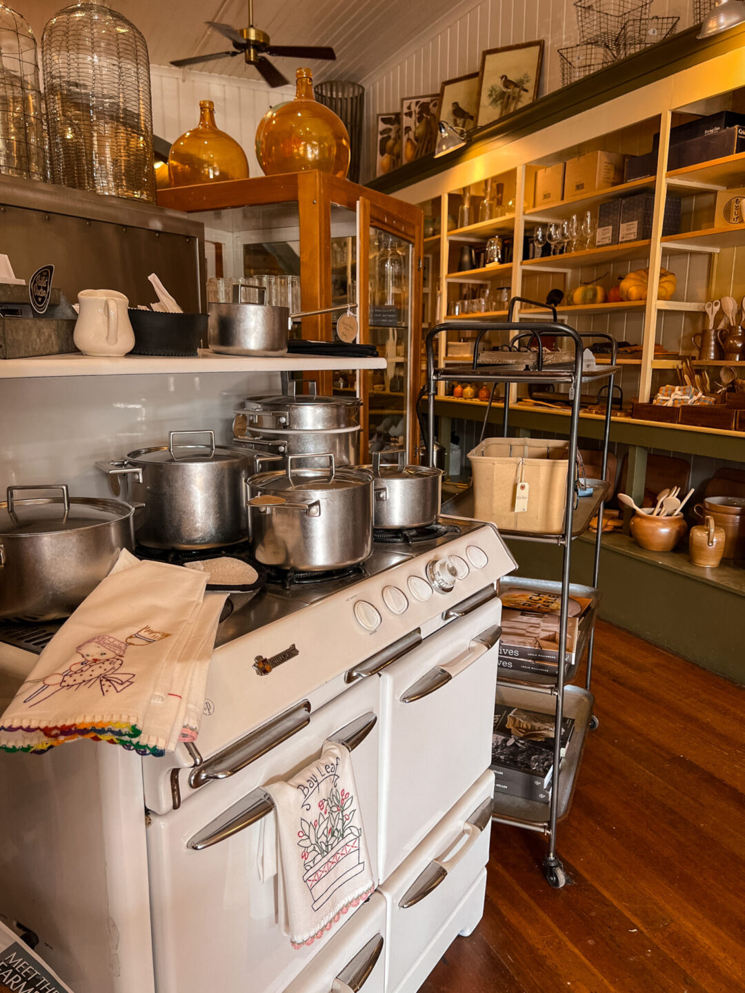The interior entrance of Farmhouse Mercantile in Boonville, California, complete with a vintage stove holding a set of pots and pans