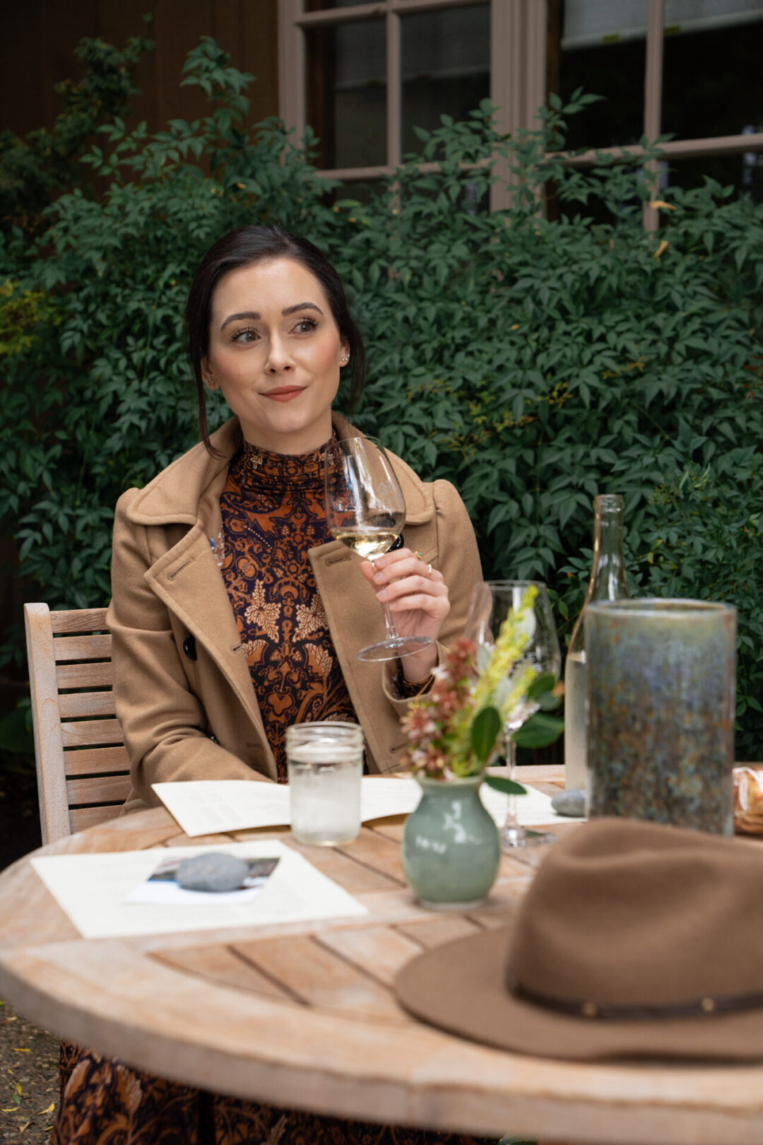 Travel Blogger Jordan Gassner smiling while looking at the picturesque view at Handley Cellars in Anderson Valley, California