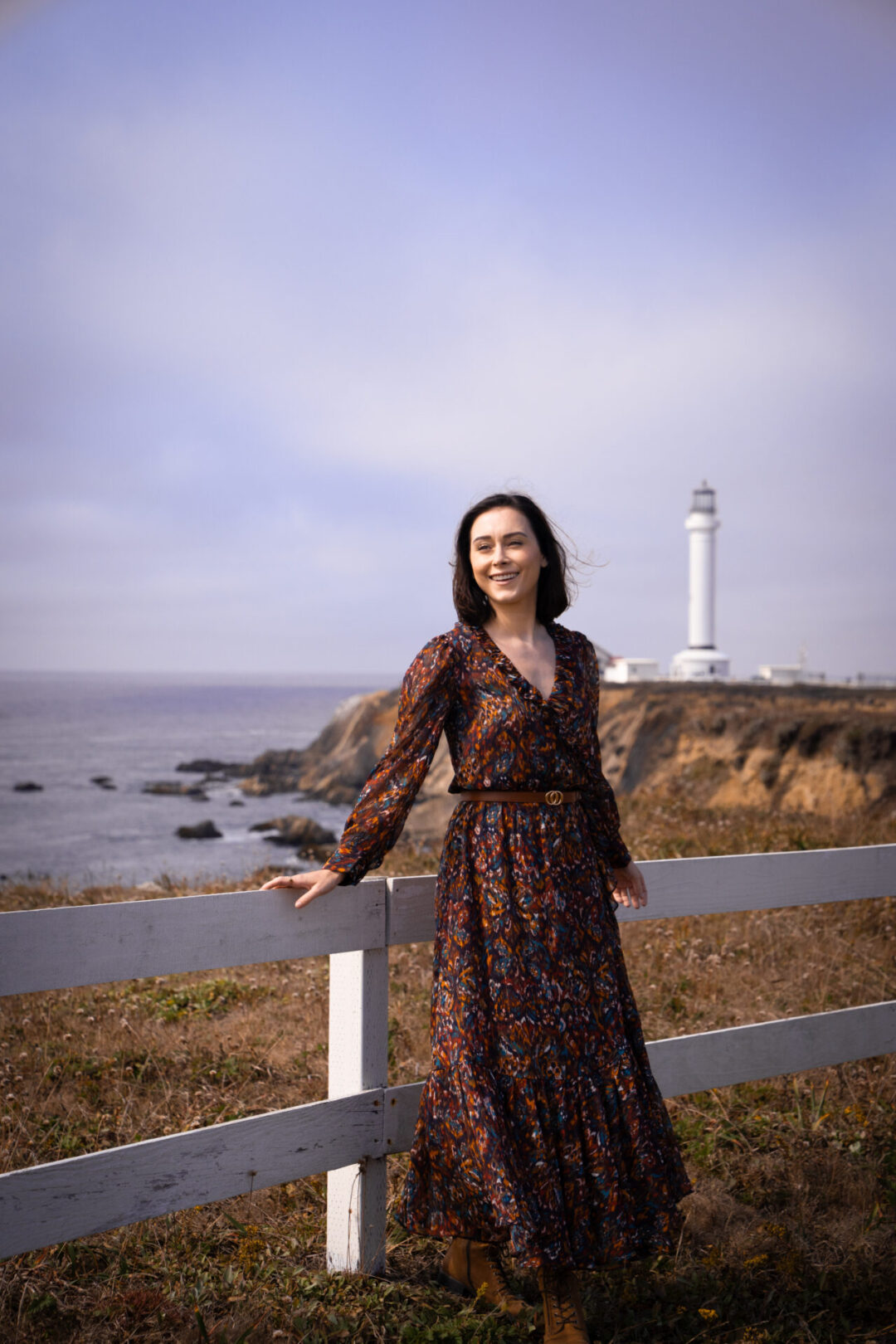 Mendocino Travel Guide: Travel Blogger Jordan Gassner smiling at a lookout point near Point Arena Lighthouse in Northern California