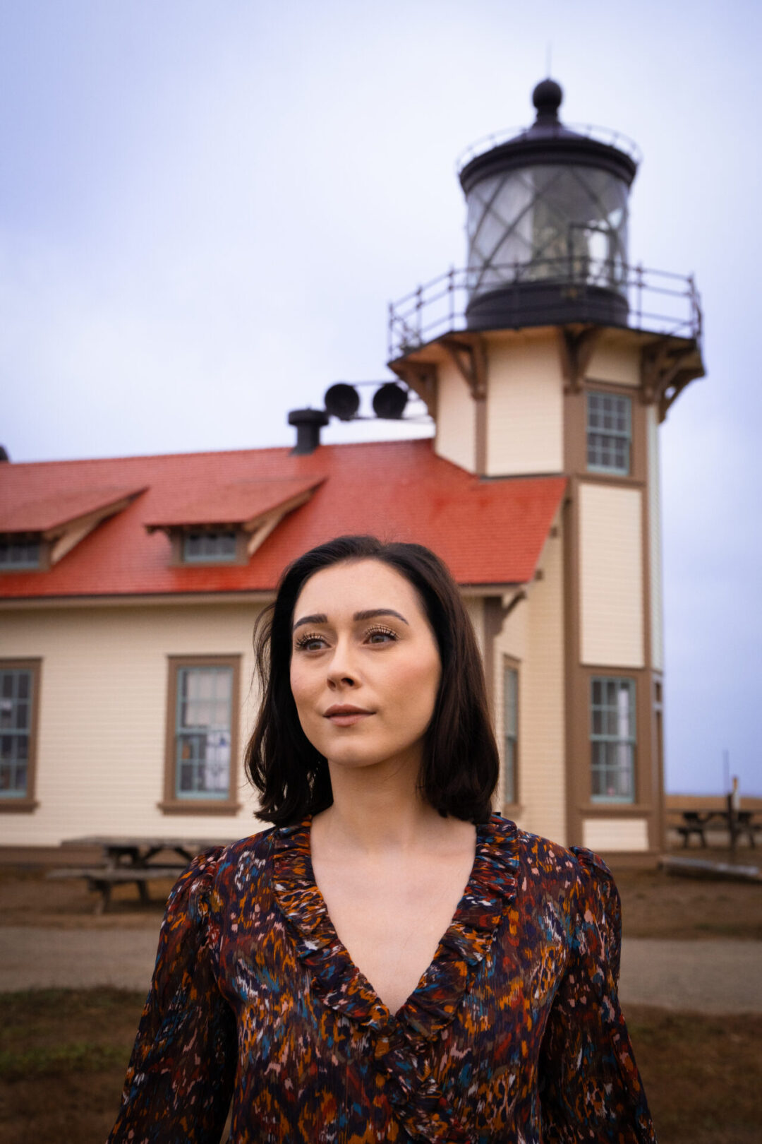 Travel Blogger Jordan Gassner looking into the distance near Point Cabrillo Lighthouse along the Northern California coast