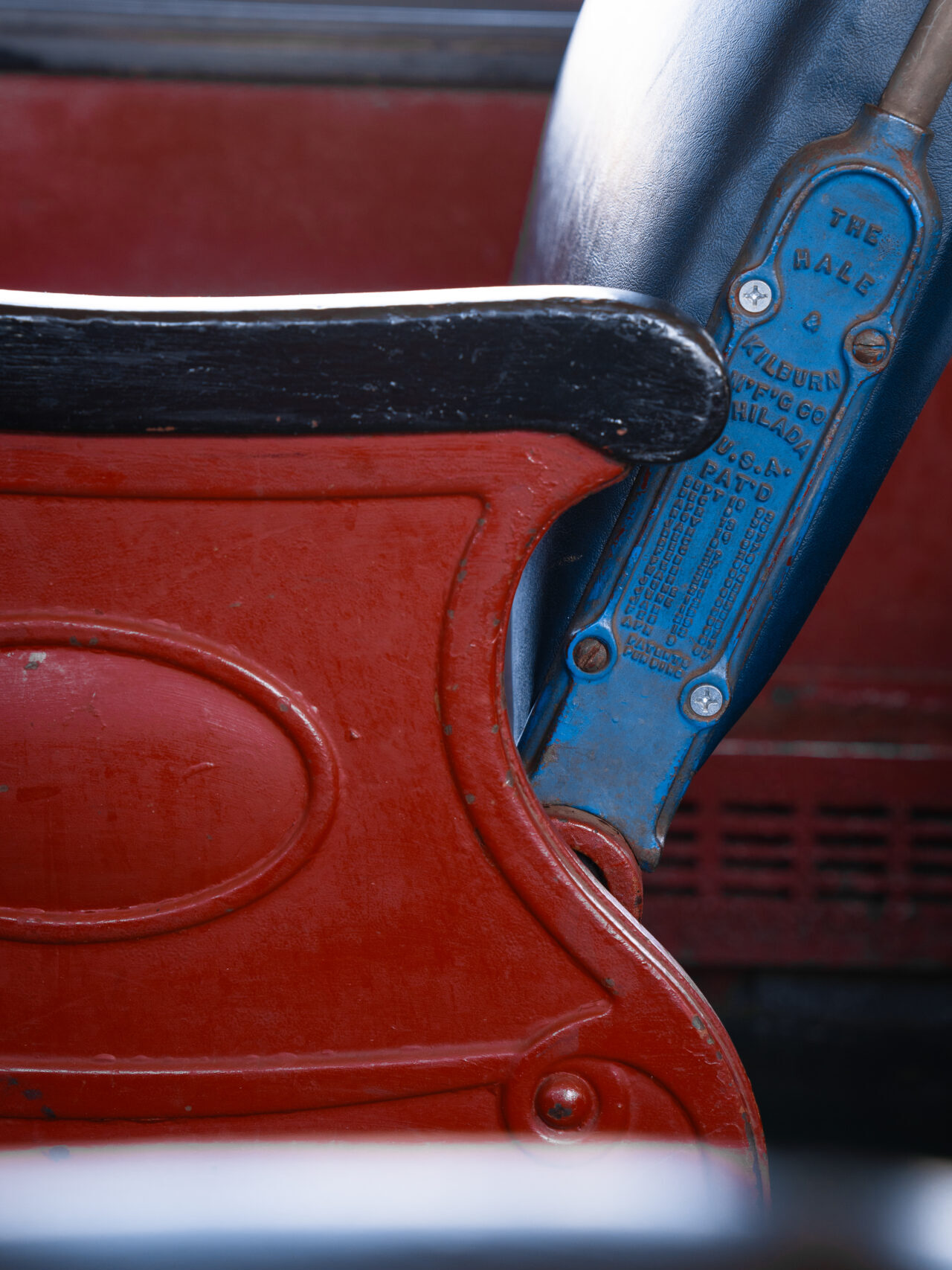 A close-up of the colorful red and blue seats aboard the Skunk Train in Fort Bragg, California