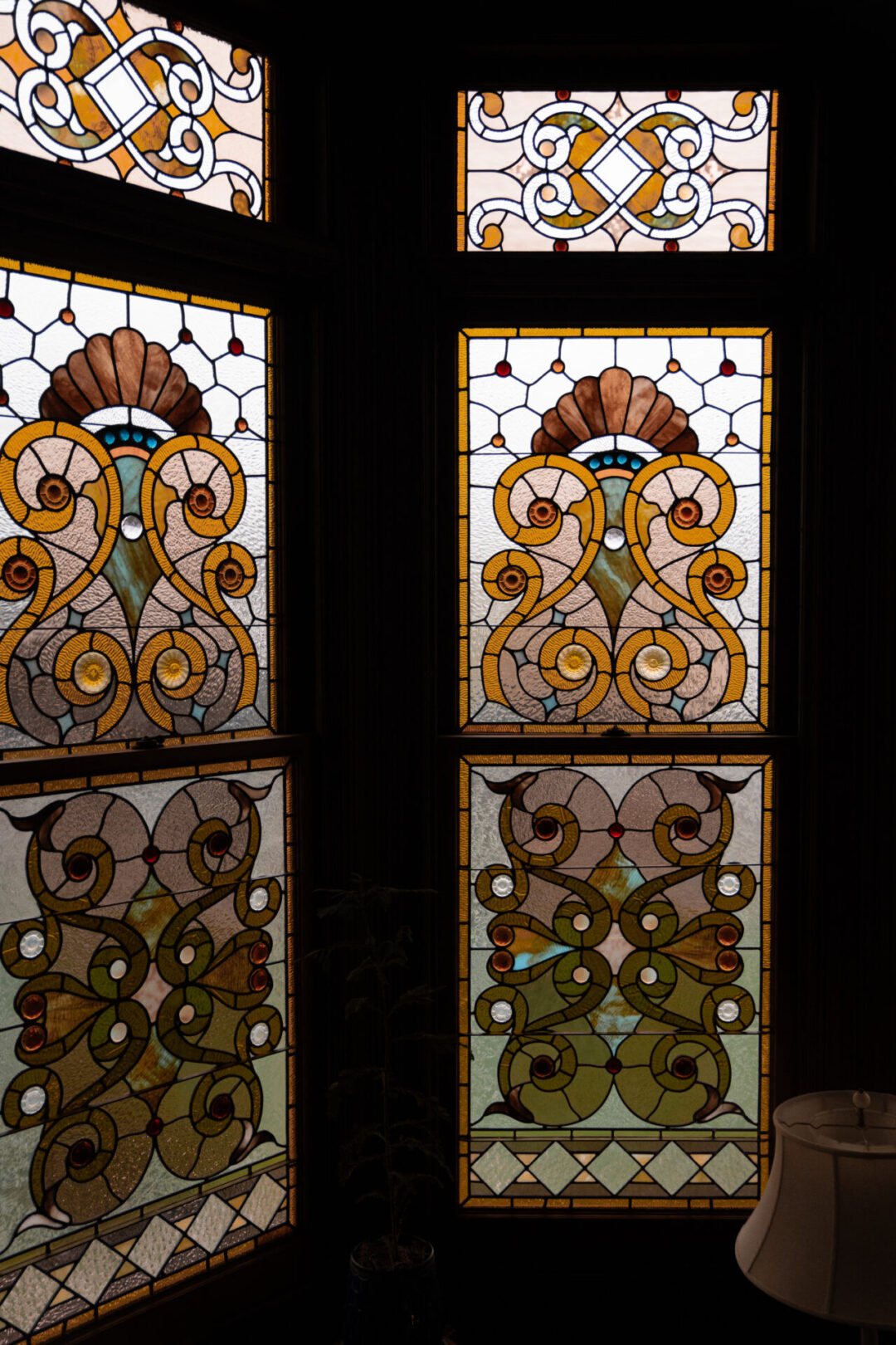The stained glass bay window at the Guest House Museum in Fort Bragg, California