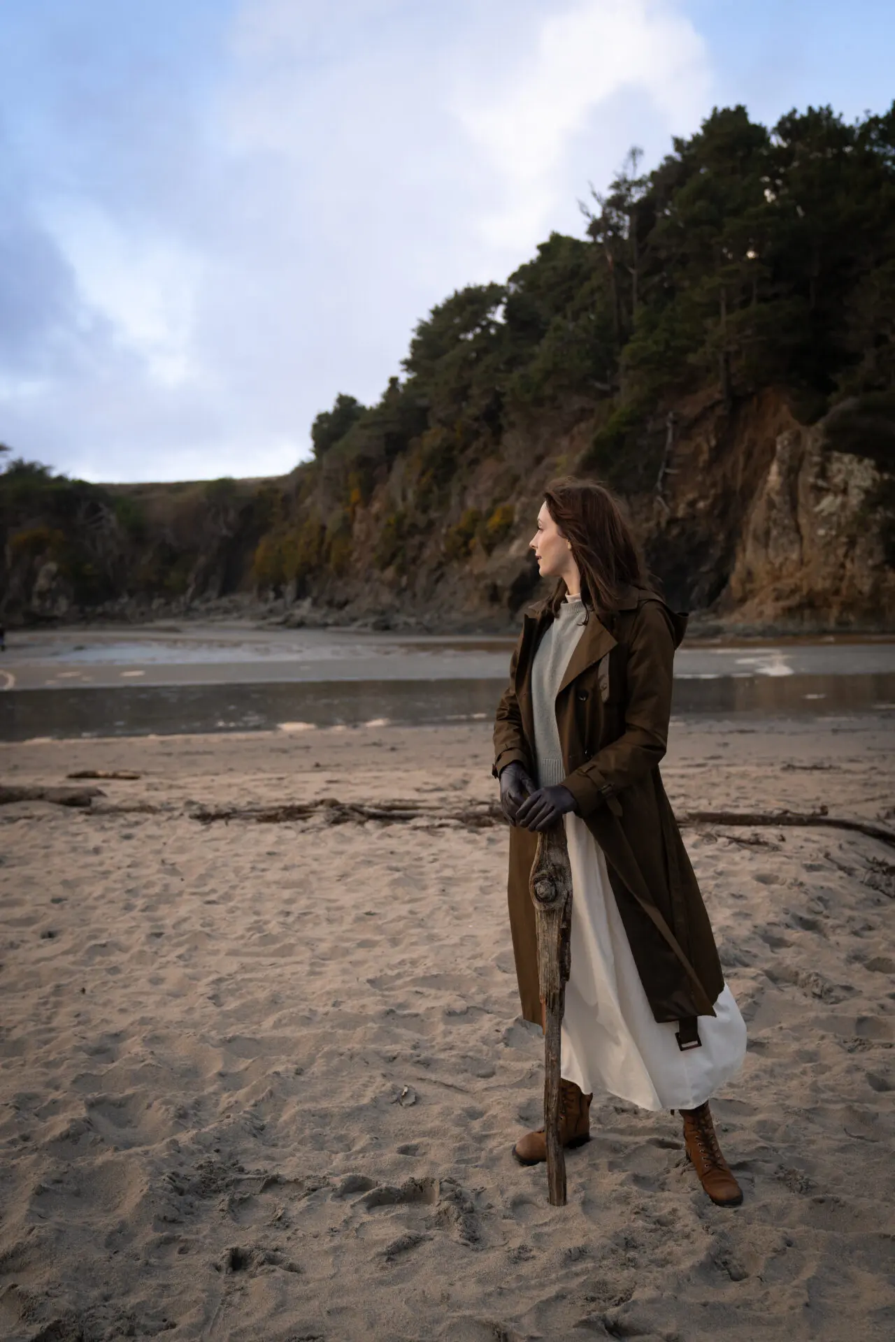 Travel Blogger Jordan Gassner standing along a beach in Mendocino, California