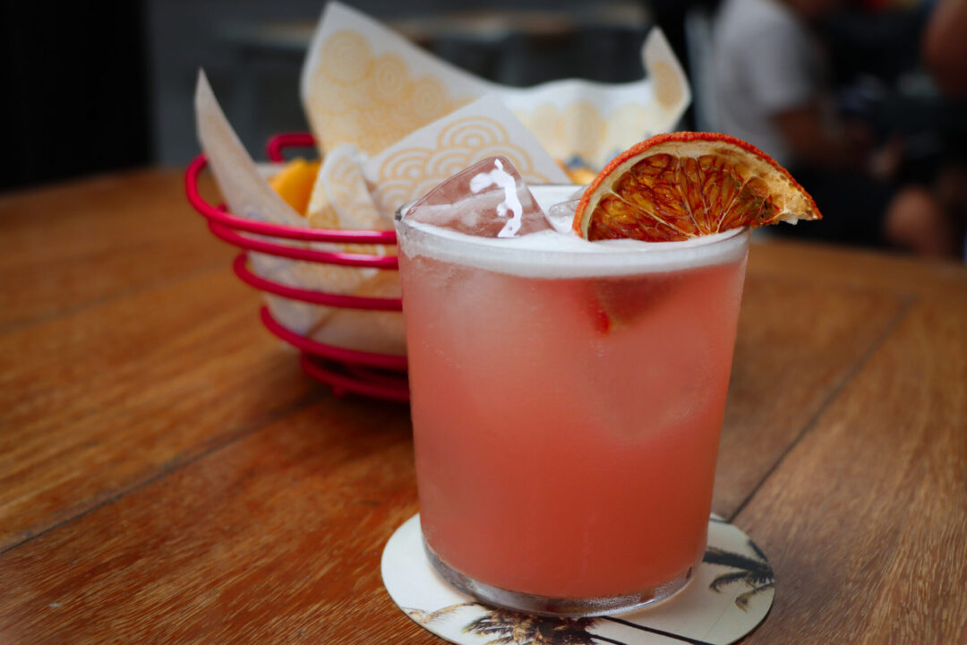 A Paloma and a bowl of sweet potato chips from El Mercado, one of the best Lima restaurants