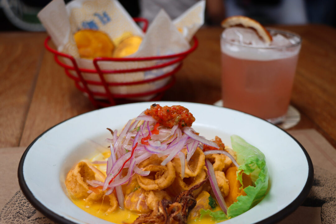 Tigre De Leche Ceviche, a paloma and a bowl of sweet potato chips from El Mercado in Lima, Peru