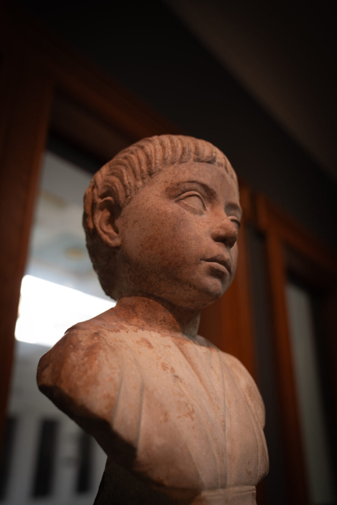 The Portrait Bust with Inscription of a young boy from AD 100-115 inside the Getty Villa in Los Angeles, California