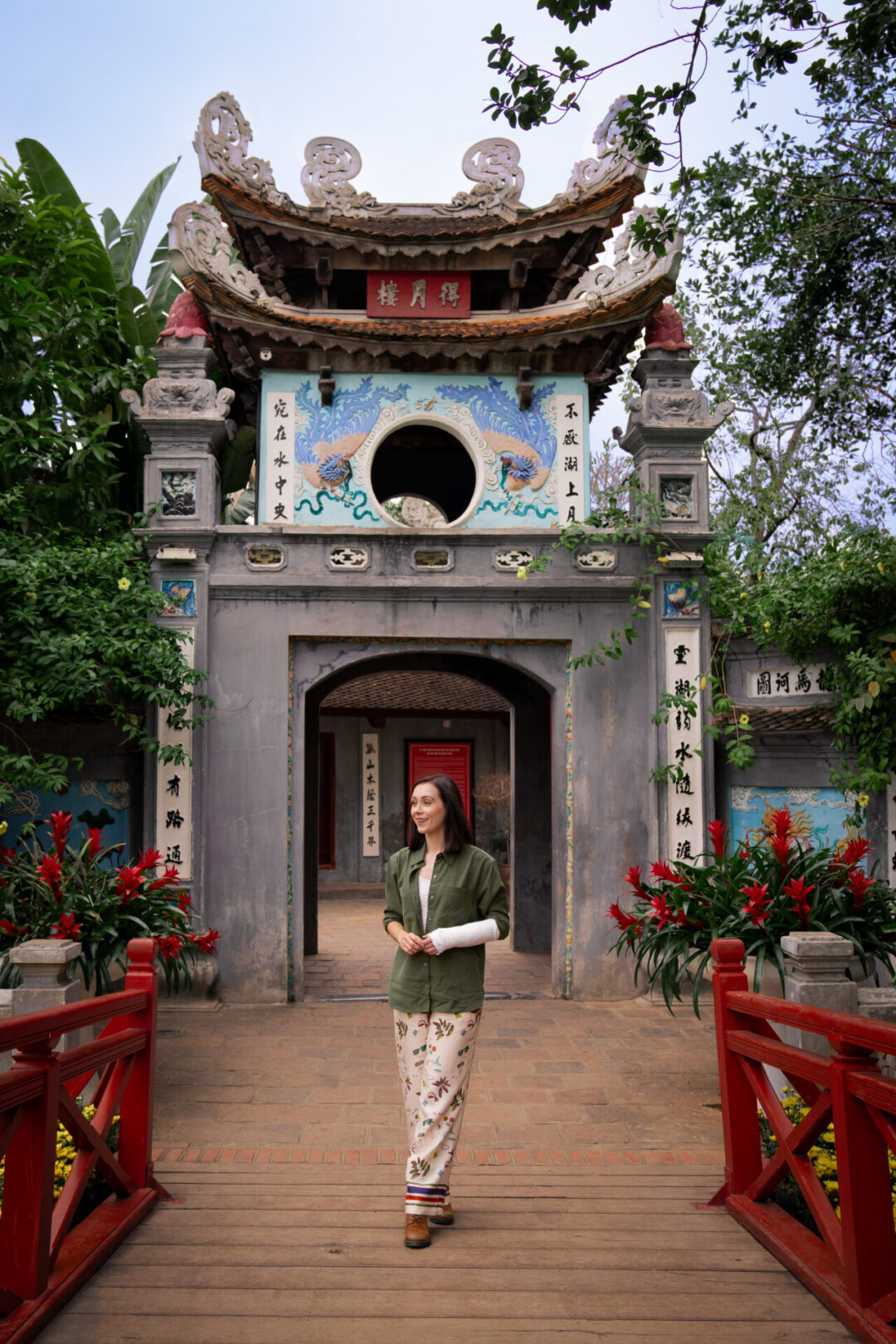 Travel Blogger Jordan Gassner standing in front of the front of Ngoc Son Pagoda in Hanoi, Vietnam