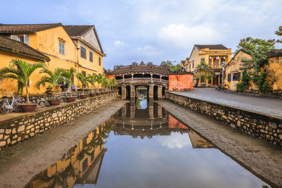 The Japanese Covered Bridge in Hoi An, Vietnam under a blue sky